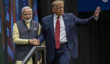 Narendra Modi & Donald Trump Walking Towards The Crowd By Holding Hands.